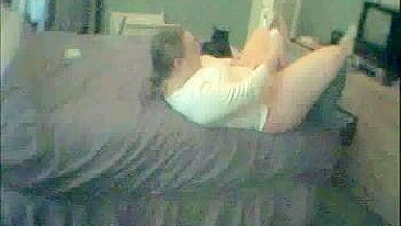 Plump mom masturbates on the bed while family is away, caught on a hidden camera!