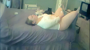 Plump mom masturbates on the bed while family is away, caught on a hidden camera!