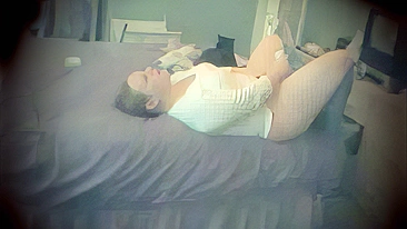 Plump mom masturbates on the bed while family is away, caught on a hidden camera!