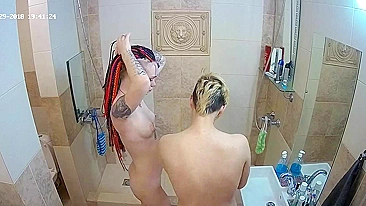 A lesbian caught sister in the shower and immediately joined her for some XXX