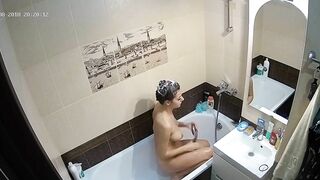 Kinky caught sister is getting clean in the tub while the camera is recording