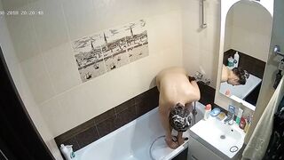 Kinky caught sister is getting clean in the tub while the camera is recording