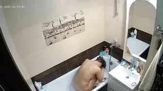 Kinky caught sister is getting clean in the tub while the camera is recording