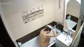 Kinky caught sister is getting clean in the tub while the camera is recording