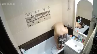 Kinky caught sister is getting clean in the tub while the camera is recording