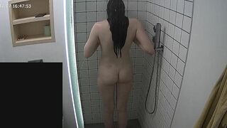 Another video featuring a caught sister making her entire body wet in the shower