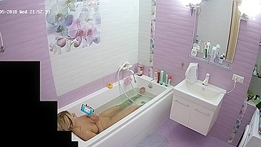 The blonde woman is just chilling in the tub looking for some caught sister porn