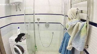 A redheaded caught sister gets in the shower and makes her figure all wet