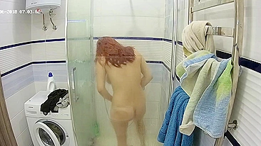 A redheaded caught sister gets in the shower and makes her figure all wet