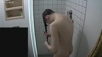The caught sister continues having her shower unaware of the hidden camera