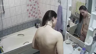 Another caught sister is blissfully unaware that the camera is filming her