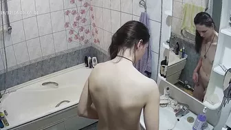 Another caught sister is blissfully unaware that the camera is filming her