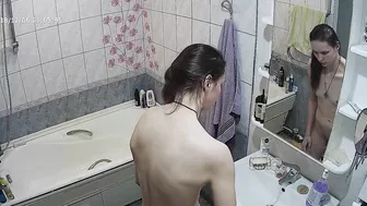 Another caught sister is blissfully unaware that the camera is filming her