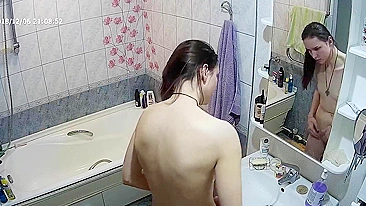 Another caught sister is blissfully unaware that the camera is filming her