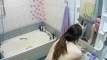 Another caught sister is blissfully unaware that the camera is filming her