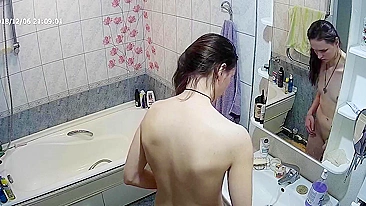 Another caught sister is blissfully unaware that the camera is filming her