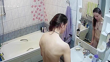 Another caught sister is blissfully unaware that the camera is filming her