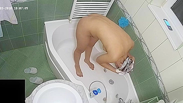 A hidden camera put on the top of the bath leads to another caught sister