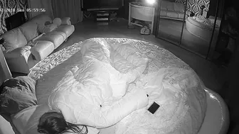 The caught sister is shown in black and white as she puts her hands in her hole