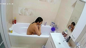A random camera in the bathroom caught sister rubbing her figure in the tub