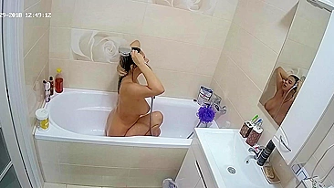 A random camera in the bathroom caught sister rubbing her figure in the tub