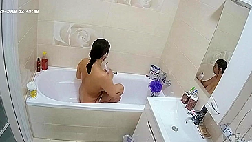 A random camera in the bathroom caught sister rubbing her figure in the tub