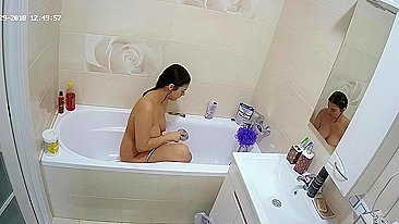 A random camera in the bathroom caught sister rubbing her figure in the tub