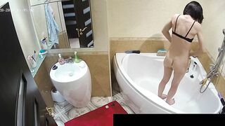 Another caught sister with a fat ass is naked while showing off in the bath