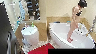 Another caught sister with a fat ass is naked while showing off in the bath