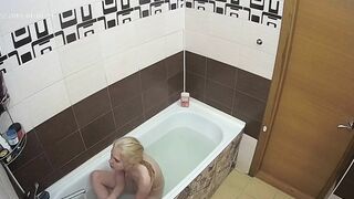 A hidden cam caught sister with natural tits naked while enjoying her bath