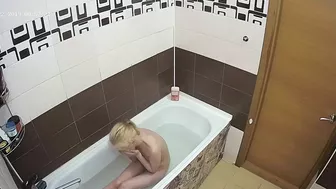 A hidden cam caught sister with natural tits naked while enjoying her bath A hidden cam caught sister with natural tits naked while enjoying her bath