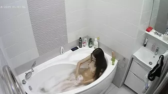 Hidden cam show of a caught sister with dark hair playing with her tits and twat