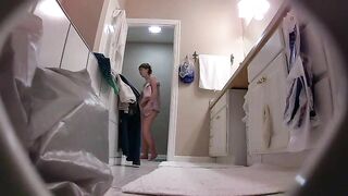 The hidden cam caught sister removing her clothes while in the bathroom