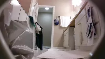 The hidden cam caught sister removing her clothes while in the bathroom