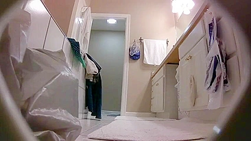 The hidden cam caught sister removing her clothes while in the bathroom