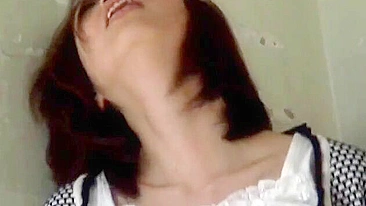 Sultry Japanese beauty gets off alone, caught by a hidden camera.