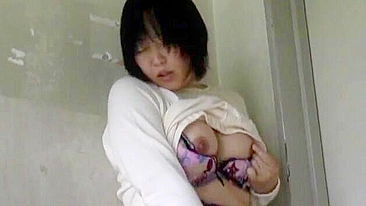 Uncensored XXX - Gorgeous Japanese girl masturbates in voyeuristic scene.