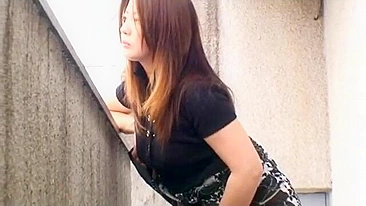 Spying on  japanese MILF neighbor masturbating on balcony