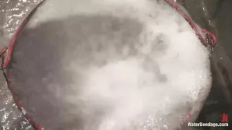 Handcuffed girl spanked with flogger under streams of water