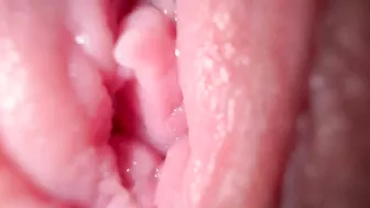 Sexy girl in close-up, talking dirty while spreading her wet pussy.