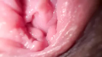 Sexy girl in close-up, talking dirty while spreading her wet pussy.