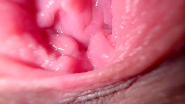 Sexy girl in close-up, talking dirty while spreading her wet pussy.