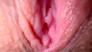 Sexy girl in close-up, talking dirty while spreading her wet pussy.