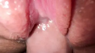 Sexy young girl with incredibly tight and creamy pussy in close-up shot.