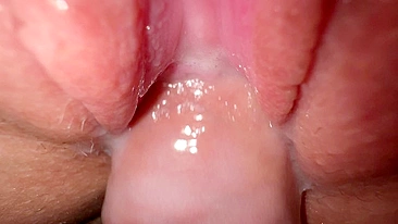 Sexy young girl with incredibly tight and creamy pussy in close-up shot.