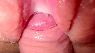 Sexy young girl with incredibly tight and creamy pussy in close-up shot.