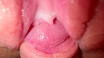 Sexy young girl with incredibly tight and creamy pussy in close-up shot.