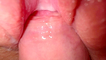 Sexy young girl with incredibly tight and creamy pussy in close-up shot.