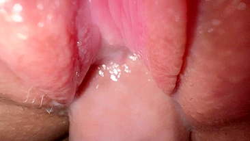 Sexy young girl with incredibly tight and creamy pussy in close-up shot.