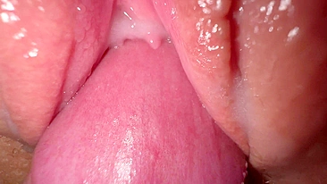 Sexy young girl with incredibly tight and creamy pussy in close-up shot.